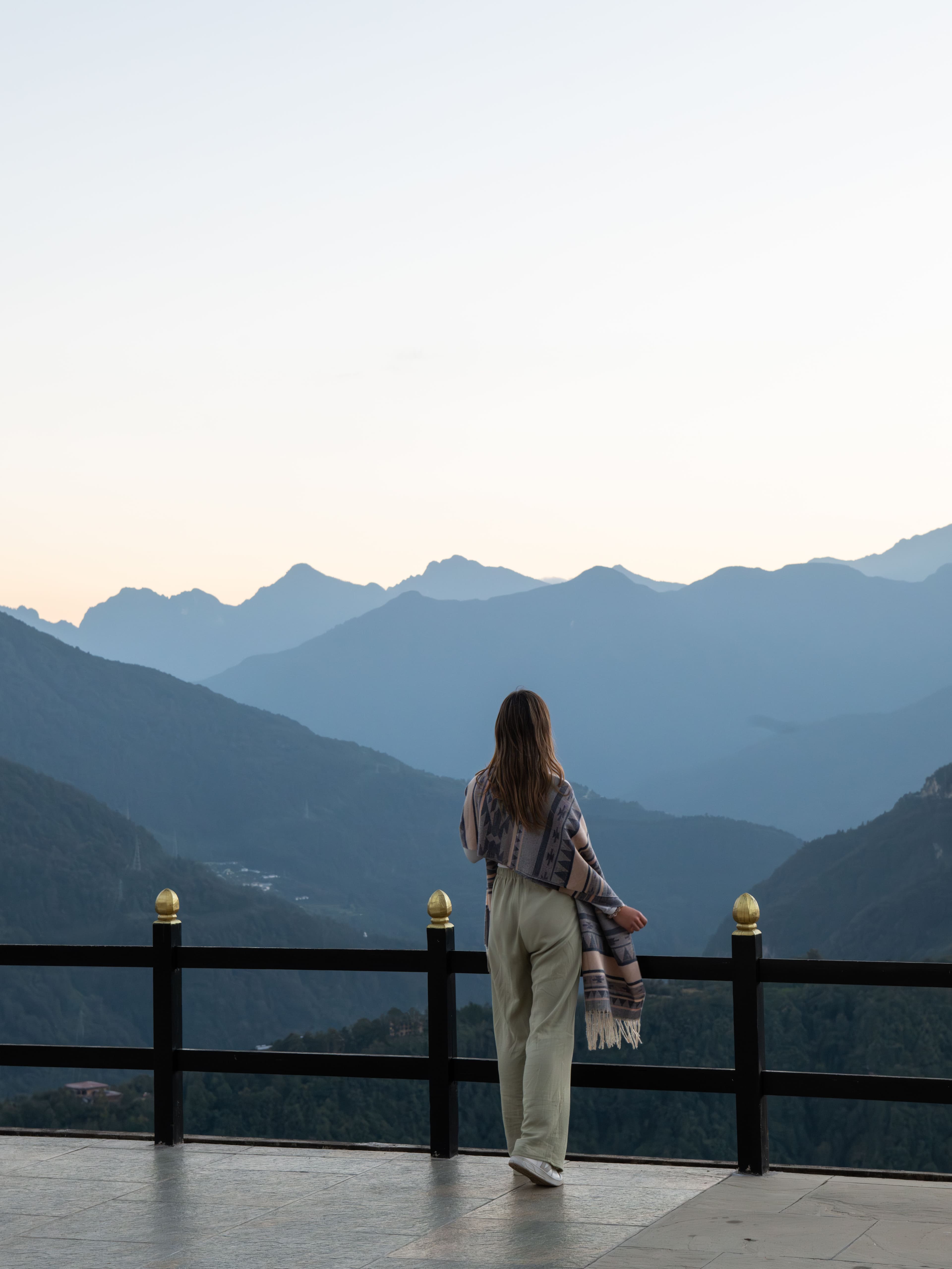 A lodge terrace looking out over the mountains at dusk